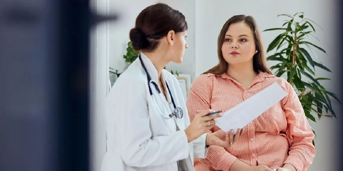 Doctor discussing GLP-1 medication management with patient at clinic showing importance of ongoing medical supervision