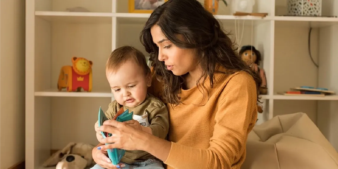 Mom reading with baby at home showing calm bonding moments during postpartum recovery