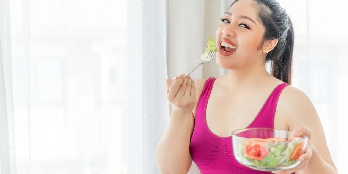 Woman eating small healthy salad showing dietary adjustments that help manage GLP-1 medication side effects like nausea