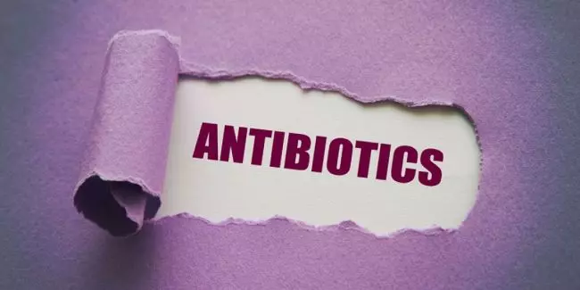 Antibiotics text on purple background