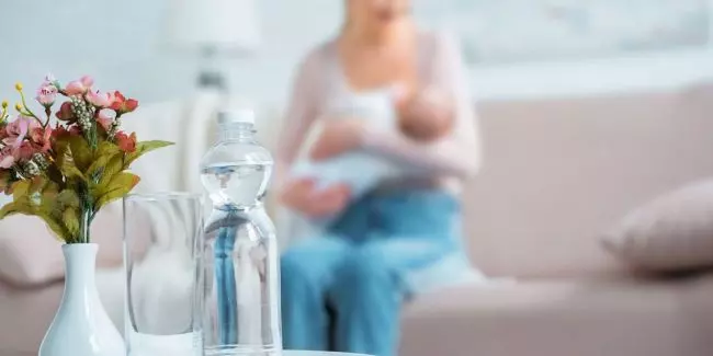 Water-bottle-near-a-breastfeeding-mom-showing-the-importance-of-hydration-during-nursing.jpg