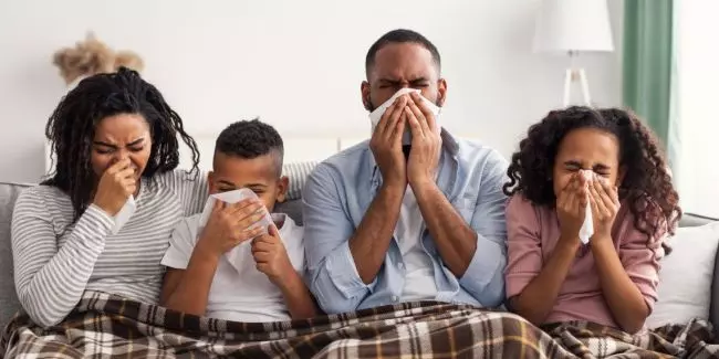 FeaturedImage-family-sick-at-home-under-blanket.jpg