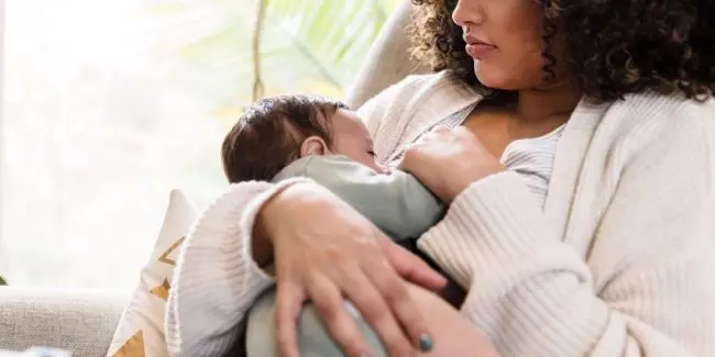 New mom with baby at home postpartum