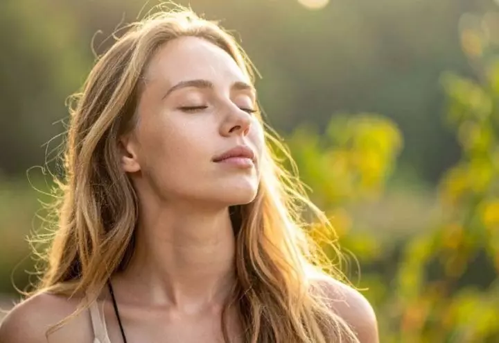 Woman finding calm outdoors to manage stress