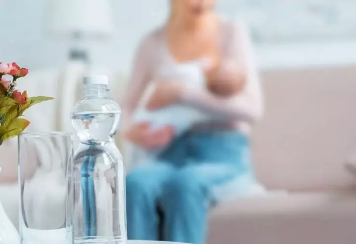 Water-bottle-near-a-breastfeeding-mom-showing-the-importance-of-hydration-during-nursing.jpg