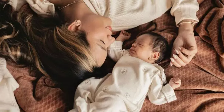 Mom and baby bonding during nap time