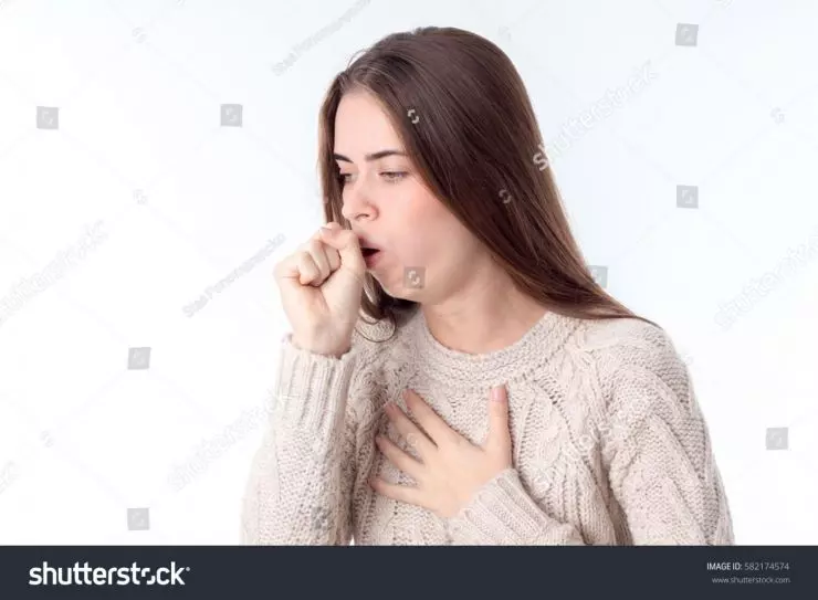 stock-photo-young-girl-fell-ill-and-coughing-582174574.jpg