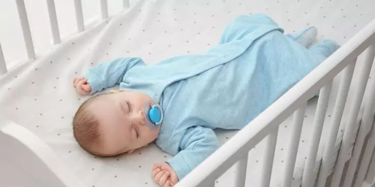 Safe sleep setup with baby in sleep sack