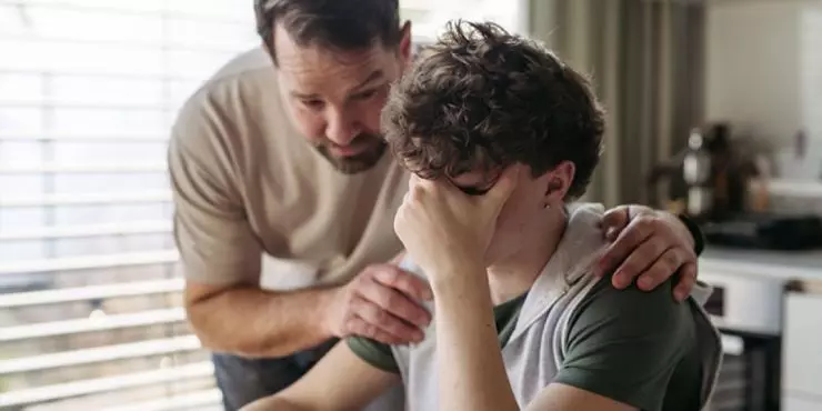 Parent supporting teen with back to school anxiety through calm conversation