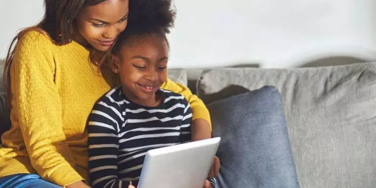 Mom-and-daughter-watching-tablet-together-showing-healthy-co-viewing-screen-time-habits.jpg