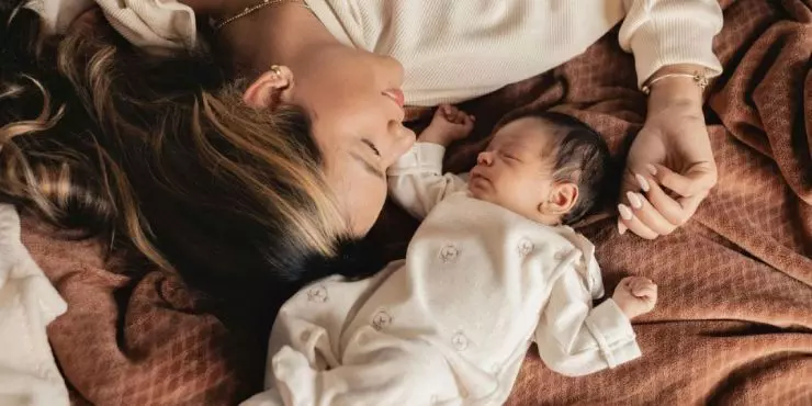 Mom laying comfortably with newborn