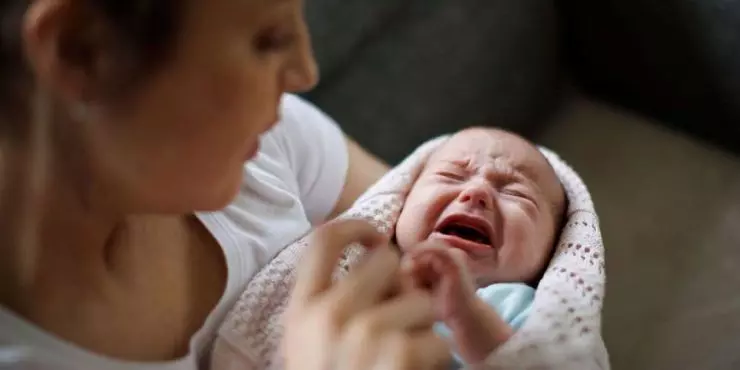 Mom-trying-to-console-uncomfortable-crying-baby.jpg