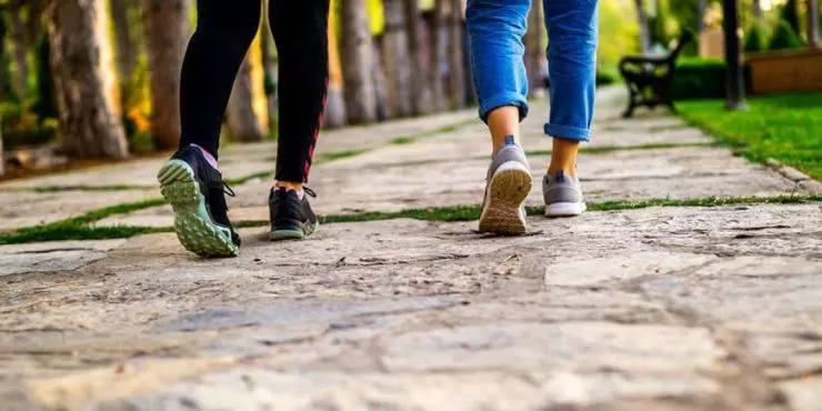 Two-people-walking-outdoors-in-spring-as-the-first-step-to-rebuilding-movement-after-winter.jpg