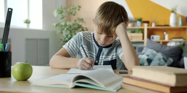 Elementary age child worrying about schoolwork during the back to school transition
