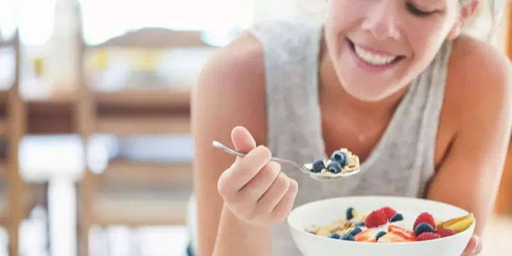 Woman eating a small protein-focused snack while on a GLP-1 medication