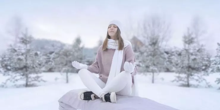 Woman-outside-meditating-in-winter.jpg