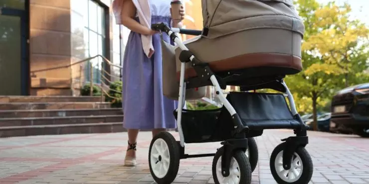 Postpartum mom walking with stroller