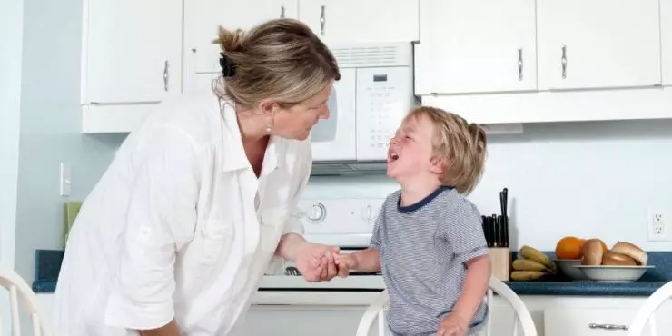 Mom comforting upset toddler during end of day meltdown